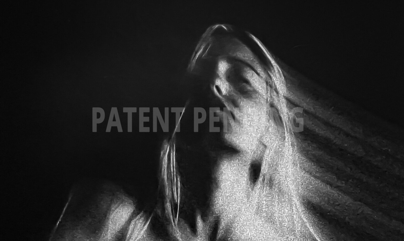 Close up of a woman with closed eyes in a dreamy pose. long exposure with rays of light leaving her hairs. high grain Black and white inkjet print